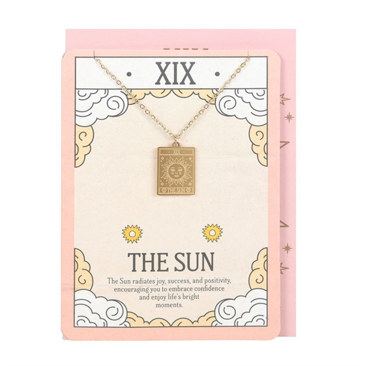 Gold necklace with a pendant on a decorative card with 'XIX The Sun' text.