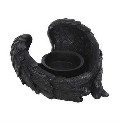 Black wing-shaped candle holder on a white background