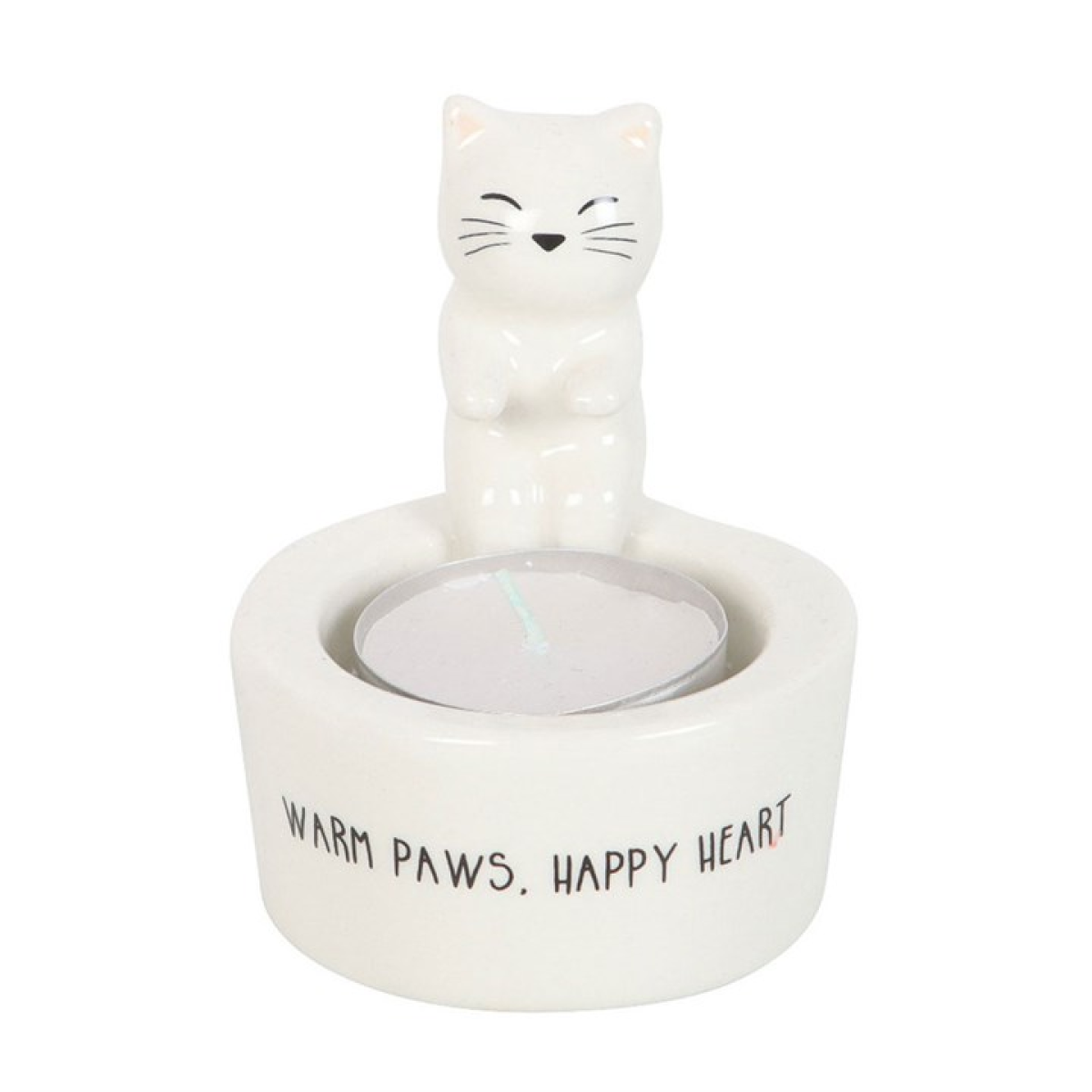 White cat sitting on edge of tealight candle holder