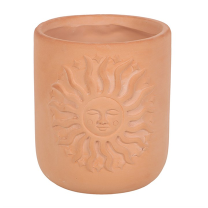 Terracotta pot with sun design on a white background