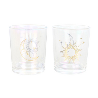 Two glass tumblers with celestial designs on a white background