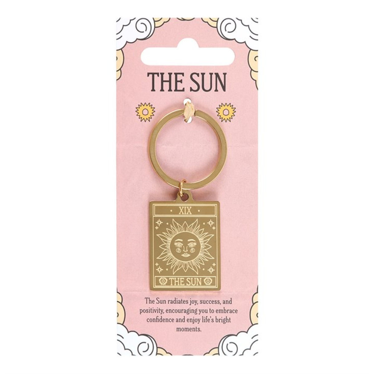 Gold keychain with 'The Sun' design on a pink packaging card.