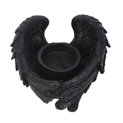 Black angel wing candle holder on a white background