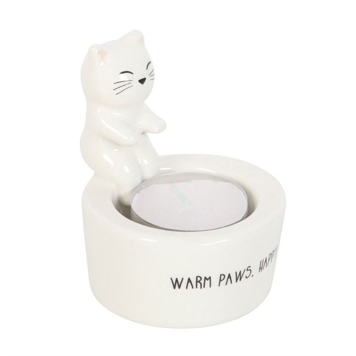 White cat sitting on edge of tealight candle holder