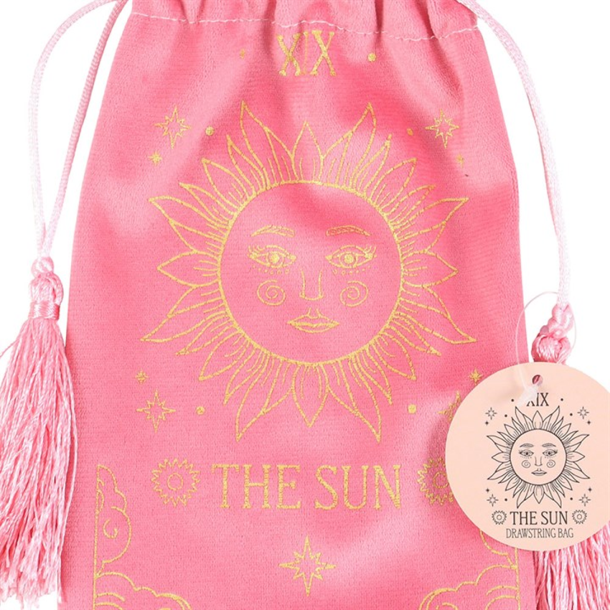 Pink drawstring bag with gold sun design and 'The Sun' text on a white background