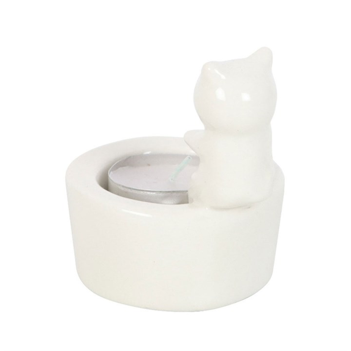 White cat sitting on edge of tealight candle holder