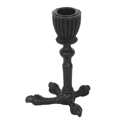 Black metal candle holder with ribbed design on a white background