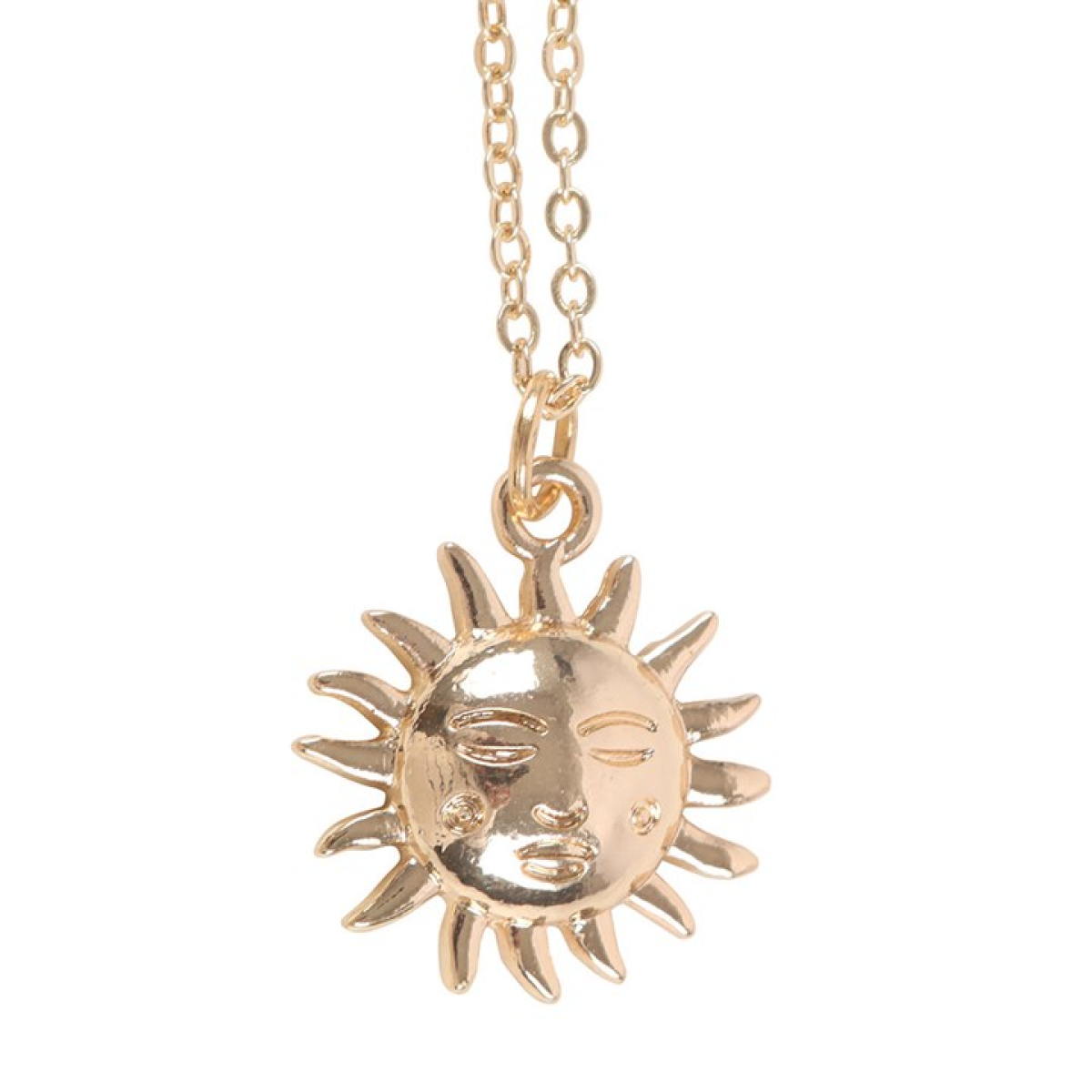 Gold sun and moon pendant necklace on a white background