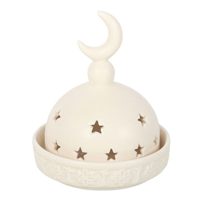Decorative lantern with moon and star designs on a white background