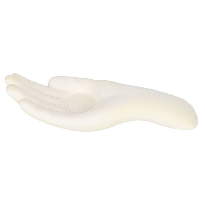 white candle holder in the shape of an open palm