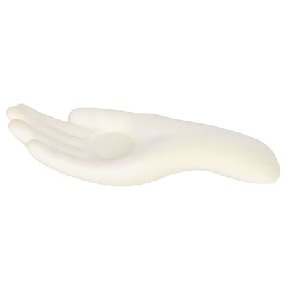 white candle holder in the shape of an open palm