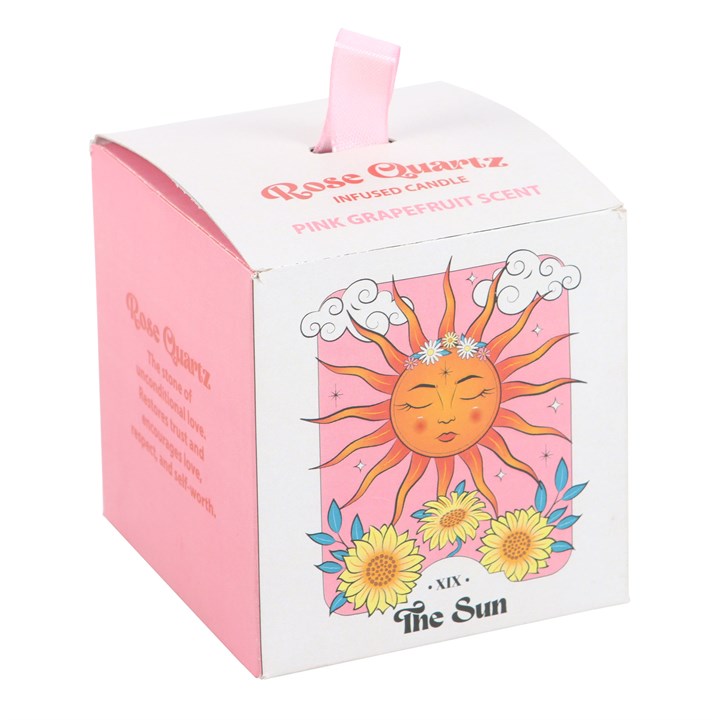 Candle packaging with sun design and text on a white background