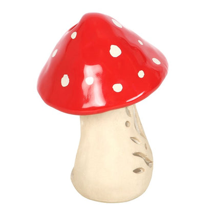 Ceramic mushroom with red cap and beige stem on a white background