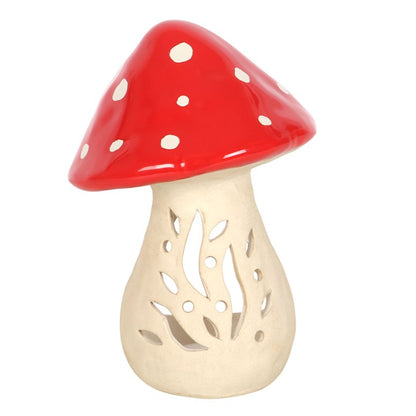 Mushroom-shaped decorative item with red cap and beige stem on a white background
