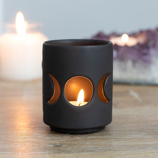 Black ceramic candle holder with triple moon design