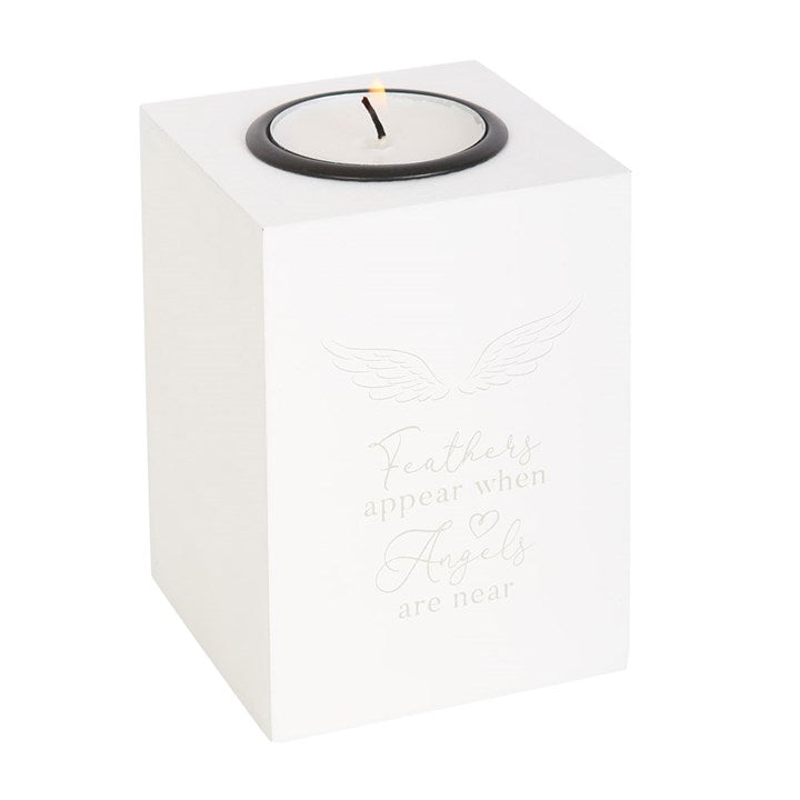 white candle holder with feather design