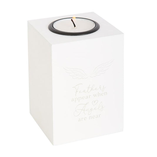white candle holder with feather design