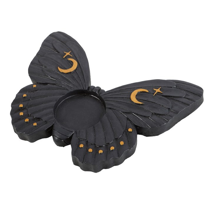 Black butterfly-shaped candle holder with gold accents on a white background