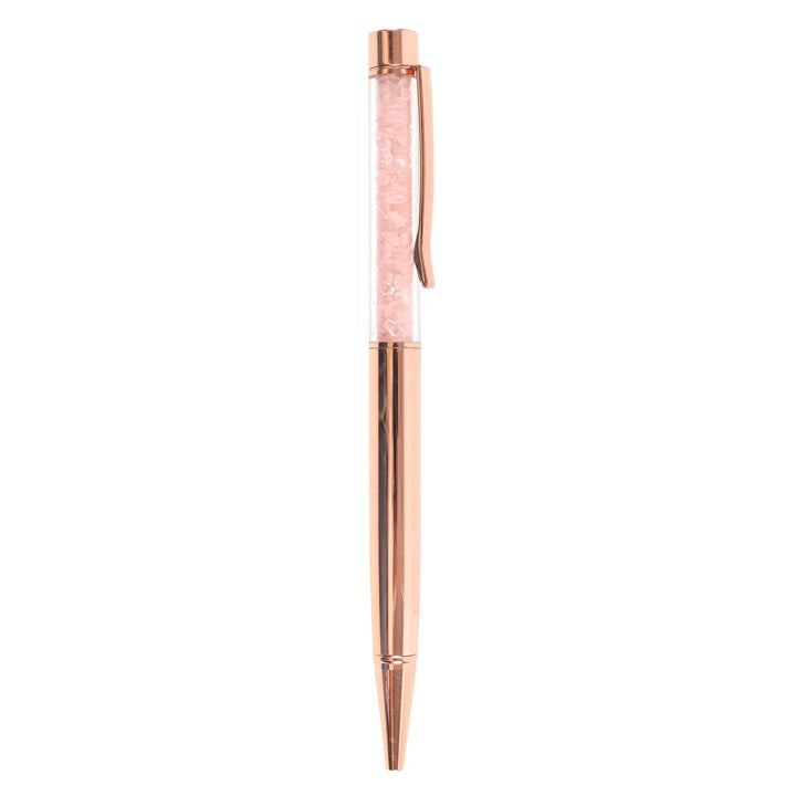 Rose gold pen on a white background