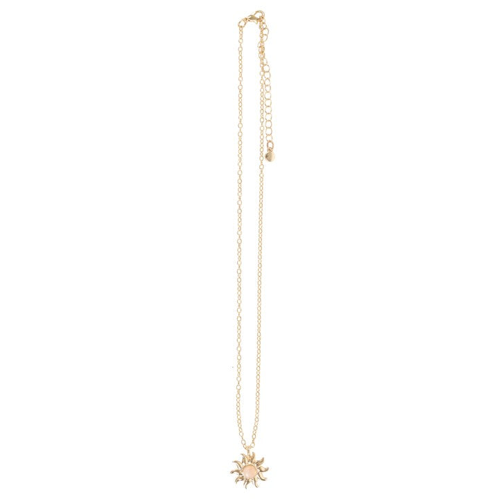 Gold necklace with a sun pendant on a white background