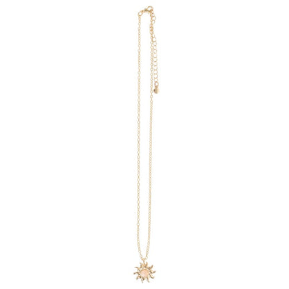 Gold necklace with a sun pendant on a white background