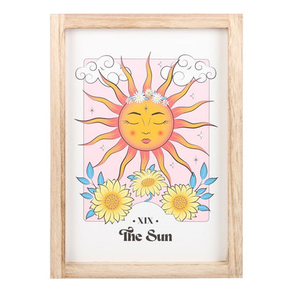 Framed artwork of a sun with flowers and 'The Sun' text on a white background