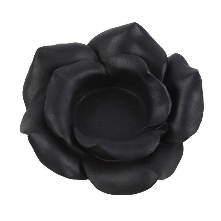 Black rose-shaped object on a white background