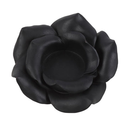 Black rose-shaped object on a white background