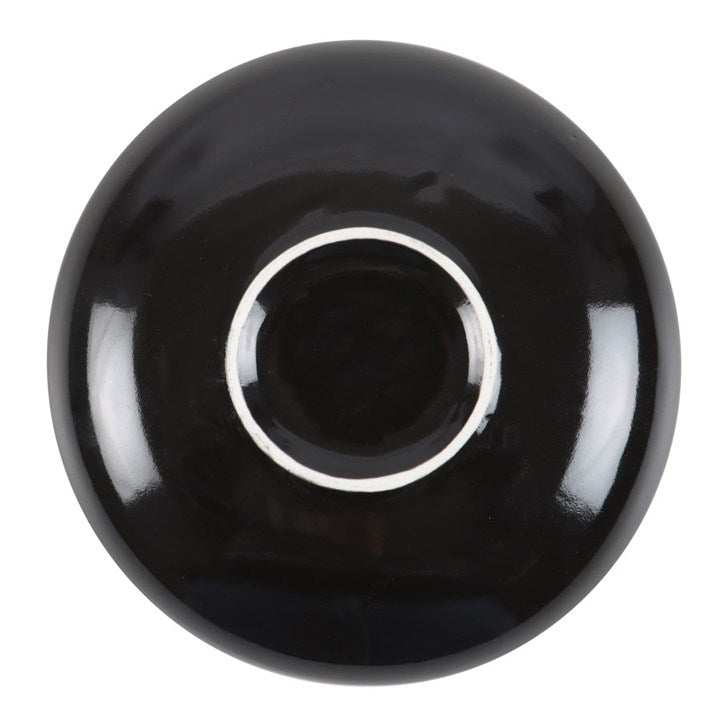 Black ceramic bowl on a white background