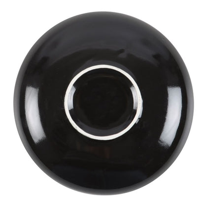 Black ceramic bowl on a white background
