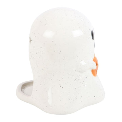 White ceramic face-shaped container with orange accents on a white background
