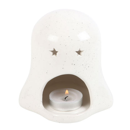 White ceramic lantern with a small candle inside on a white background