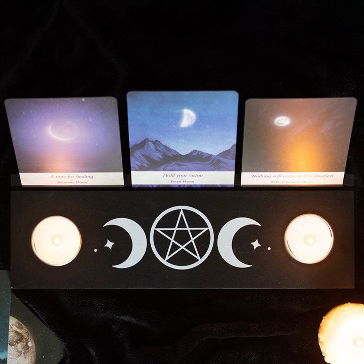 black wooden candle holder with triple moon design