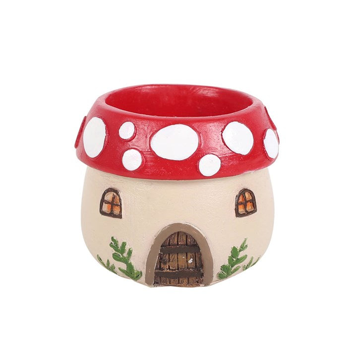 Fairy house with red mushroom cap on a white background