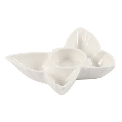 Set of three white ceramic heart-shaped bowls on a white background