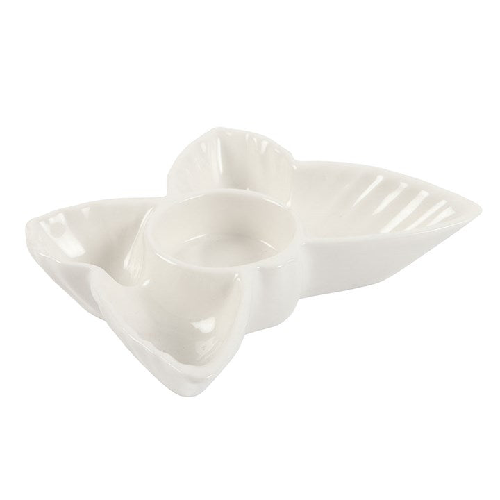 White ceramic leaf-shaped dish on a white background