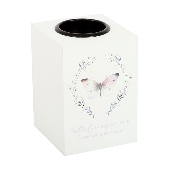 White candle holder with butterfly design