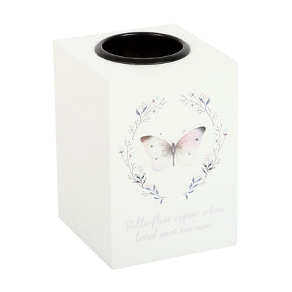 White candle holder with butterfly design