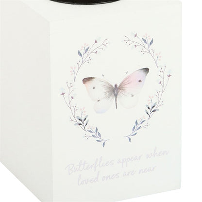 White candle holder with butterfly design
