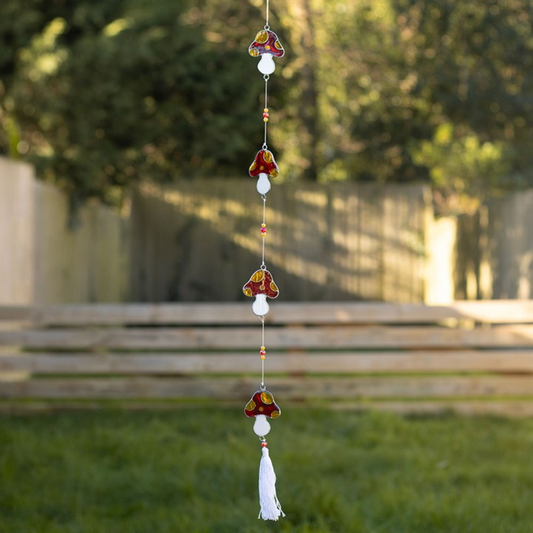 mushroom shaped suncatchers on a string of beads