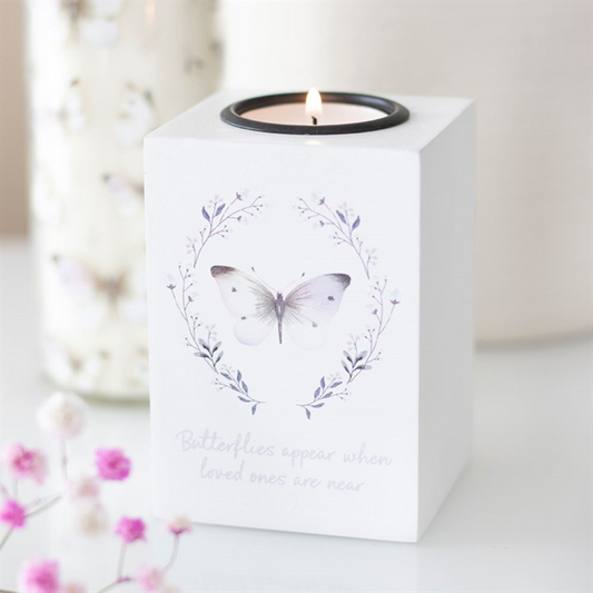 White candle holder with butterfly design