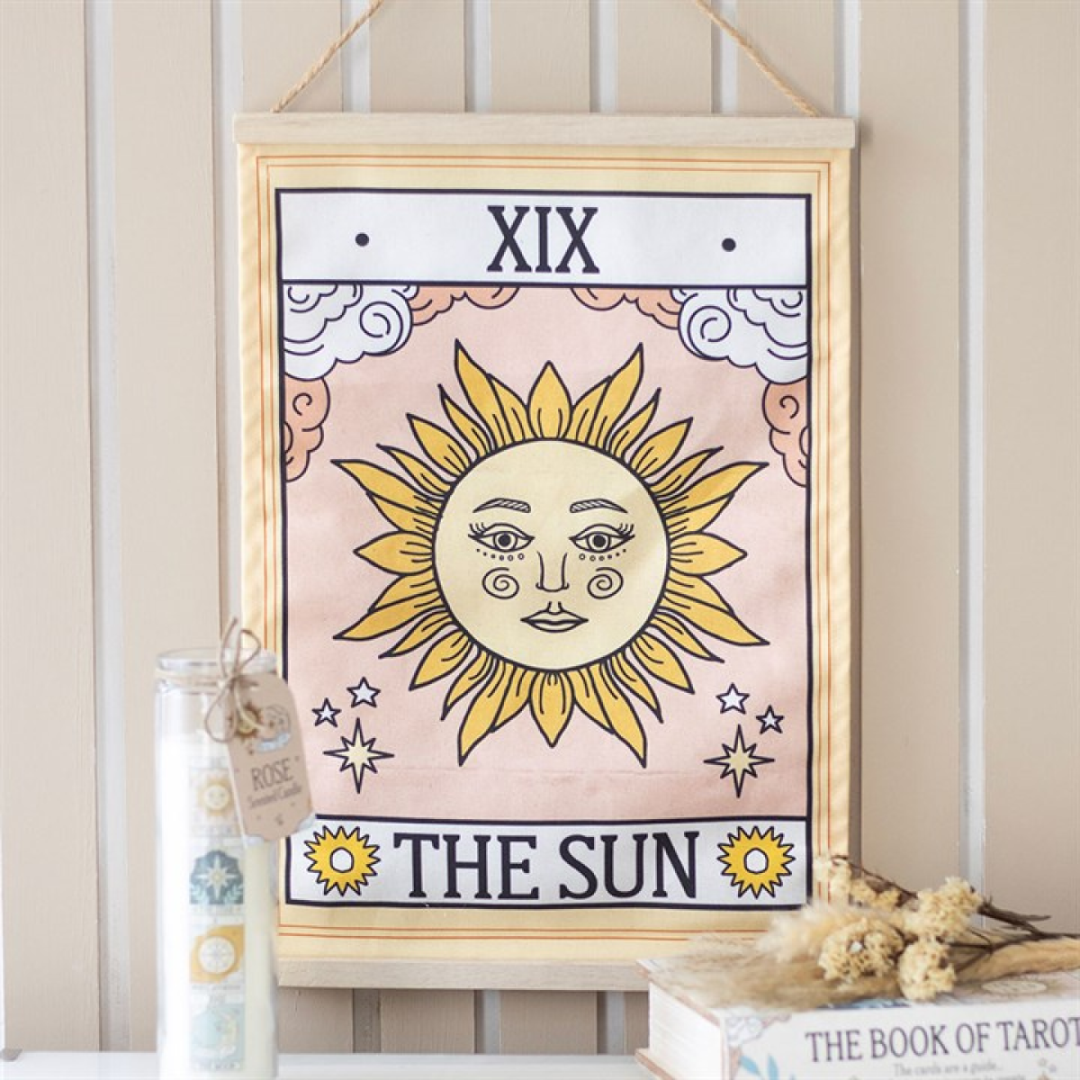 Framed tarot card titled 'The Sun' with decorative elements on a neutral background.