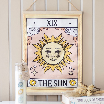 Framed tarot card titled 'The Sun' with decorative elements on a neutral background.