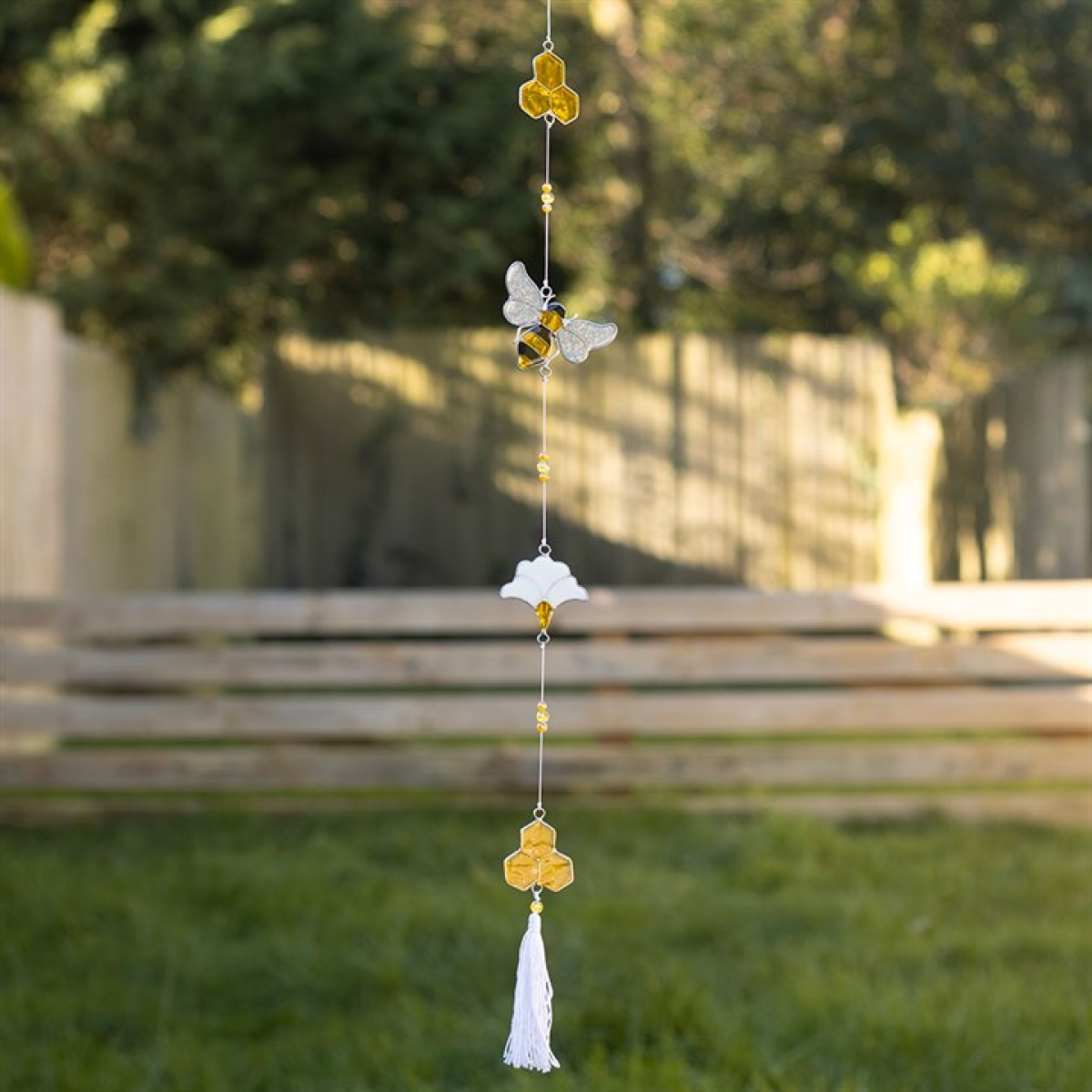 bee and honeycome suncatcher on a string of beads